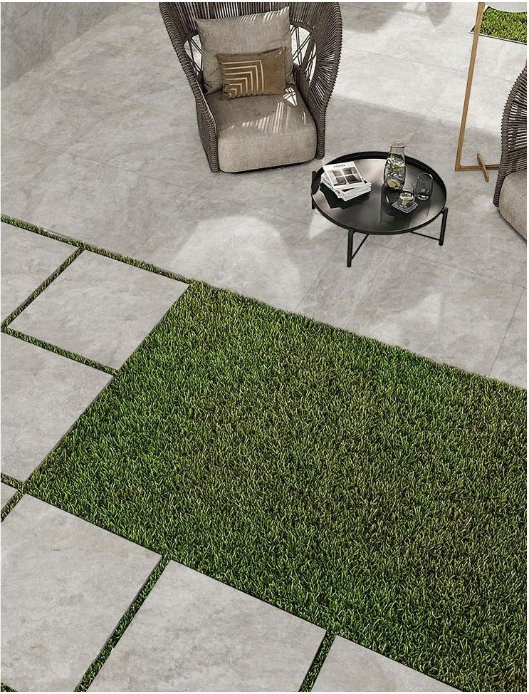 Beige porcelain paving used in a warm outdoor terrace project